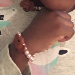 Baby Granddaughter modeling her Puppy Necklace set